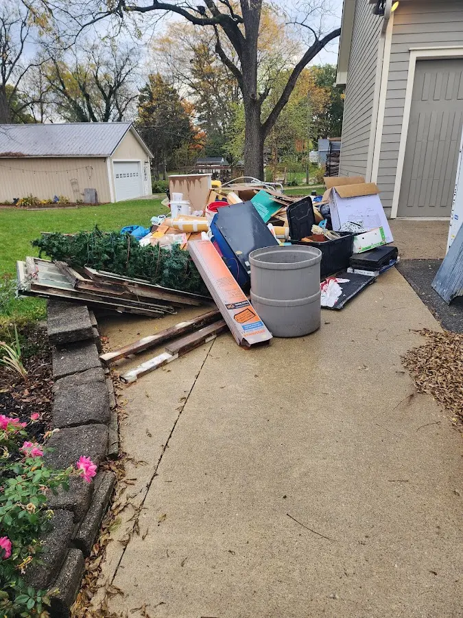 Dumpster being loaded with debris for 30 Yard Dumpster Rental in Forest Hills